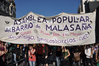 Cartel de una asamblea popular.